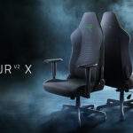 A black gaming chair with a green logo Description automatically generated